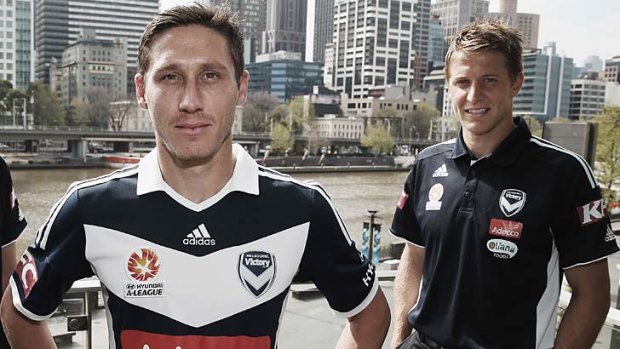 New and old: Mark Milligan (left) has replaced Adrian Leijer as Melbourne Victory captain.