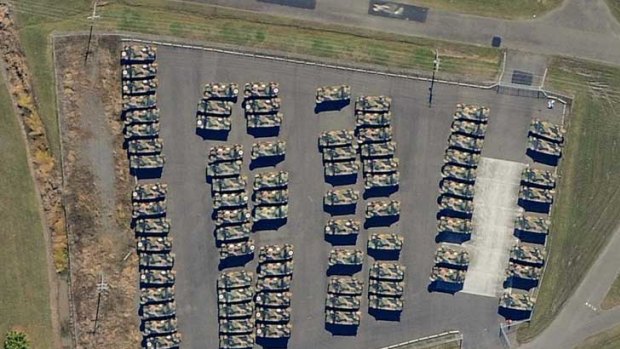 An aerial picture taken last month shows 89 Bushmasters, worth more than $90 million, in storage near Brisbane Airport.