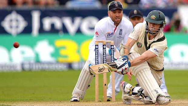 Cliffhanger: Chris Rogers brings up his maiden Test century with a sweep shot against Graeme Swann.