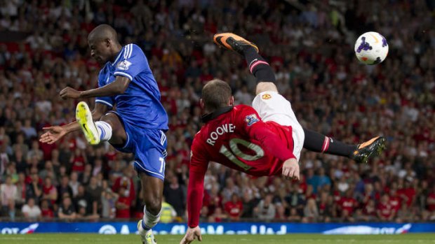In the air: Ramires tries to block a Wayne Rooney scissor kick during Monday night's scoreless draw at Old Trafford.