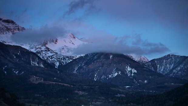 Night falls on the Alps near the site where a Germanwings flight crashed.