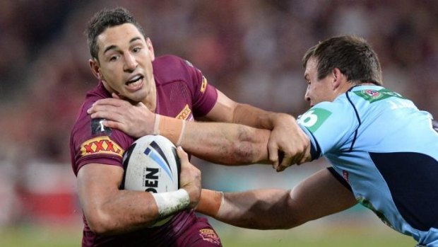 Queensland veteran Billy Slater tries to get past Blues winger Brett Morris. Scheduling needs to be addressed so Origin players don't have to miss club football.