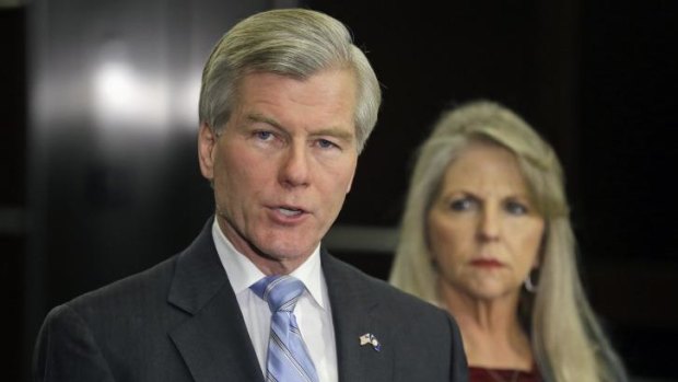 Charged with corruption: Former Virginia Governor Bob McDonnell makes a statement as his wife, Maureen, watches.