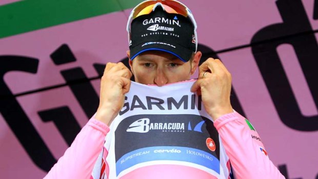 A good day ... Garmin's Ryder Hesjedal of Canada kisses the leader's pink jersey.