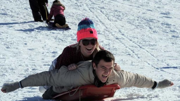 Flying high &#8230; Tamara Lloyd and Zac Solomons enjoy the opening weekend of the Australian ski season at Perisher yesterday.