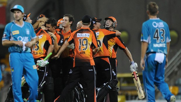 The Scorchers celebrate victory after the Big Bash League match between the Brisbane Heat and the Perth Scorchers at The Gabba on Tuesday.