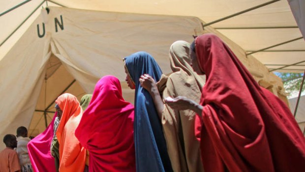 Lifeline ... women for medication outside a tented-pharmacy in Mogadishu, operated by the African Union Mission in Somalia.