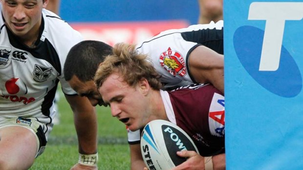 New Kangaroo ... Manly's Daly Cherry-Evans scores in yesterday's grand final.