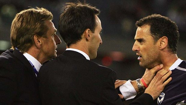 Coming to grips ... Kevin Muscat (right) clashes with John Kosmina back in 2006.
