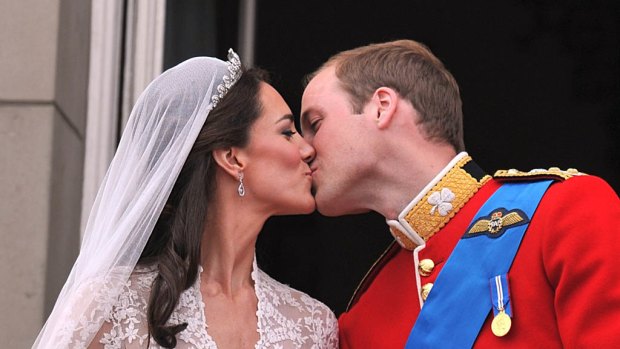 Their Royal Highnesses Prince William, Duke of Cambridge and Catherine, Duchess of Cambridge kiss on the balcony at Buckingham Palace.