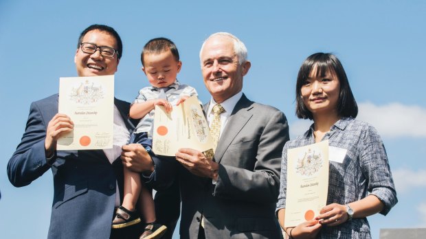 Originally from China, two-year-old Eric Guo was fascinated by his citizenship certificate as he and his parents Rui Guo and Li Wang became Australian citizens in front of Prime Minister Malcom Turbull. 