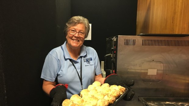 CWA member Sylvia Raper with a tray of scones made from the organisation's longstanding recipe.