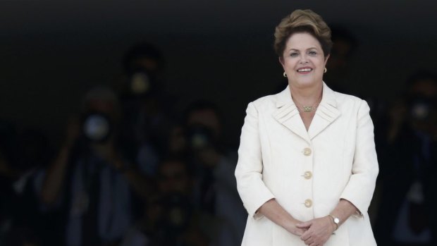 Security alert ... A sniper almost shot a policeman as he approached Brazil's President Dilma Rousseff at the opening game of the World Cup. 