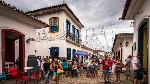 Old town streets are full of people visiting the historical centre of the city.