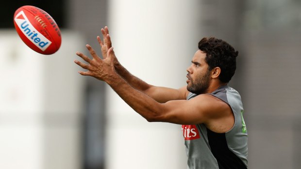 Helping hands: Daniel Wells has made an impact off the field and is ready to step up his game time with the Magpies.