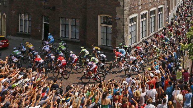 Hectic: The close proximity of spectators to the peloton was just another hazard on a stressful stage two on Sunday.