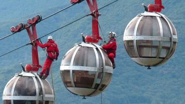 Dozens of terrified tourists were rescued by helicopter after cable cars in Grenoble became stuck.