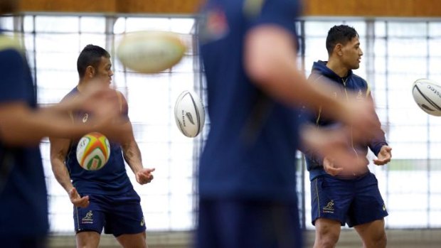 Inside ball: Kurtley Beale and Israel Folau during an indoor training session on Monday.