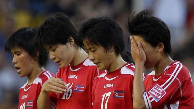 Distraught ... North Korea's players after the loss to the US.