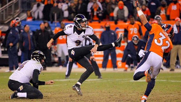 Justin Tucker of the Baltimore Ravens kicks a successful 47-yard game-winning field goal against the Denver Broncos in the second period of overtime.