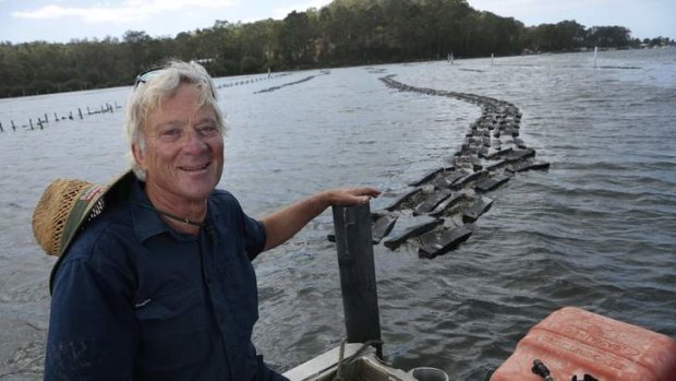 Job with a view: Kevin McAsh at the 20-hectare oyster farm near Batemans Bay.