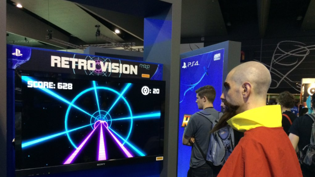 A PAX Australia attendee plays Retro Vision, one of four student-made games coming to PlayStation 4.