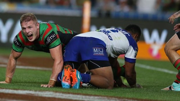 Roaring Rabbitoh: George Burgess celebrates his try.