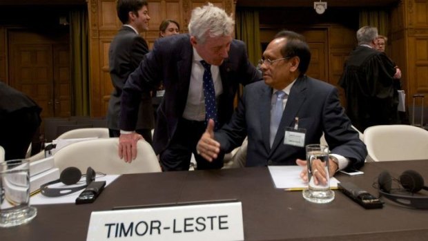 Postponed: East Timor Foreign Affairs Minister Jose Luis Gutierrez (R) speaks with Australian lawyer Bernard Collaery during a hearing of the International Court of Justice in The Hague earlier this year.