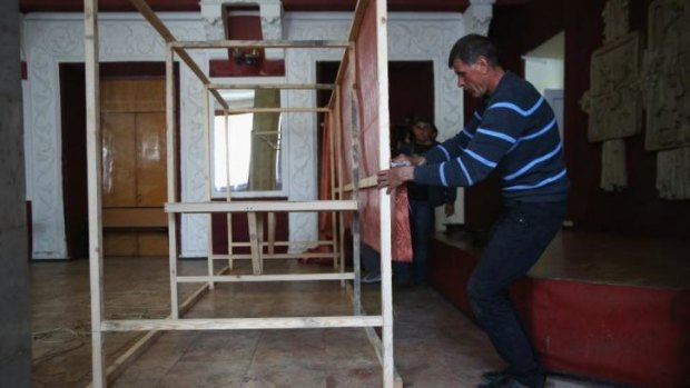 Rickety ballot: carpenters build voting booths in Slaviansk ahead of Sunday's proposed referendum on self-rule.