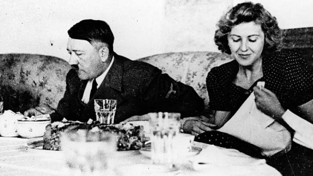 Adolf Hitler and his mistress Eva Braun dining.