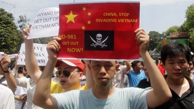 Permitted protests: Vietnamese demonstrators hold anti-Chinese placards in Hanoi. The violence targeting factories thought to be Chinese-owned marks an escalation in the standoff.