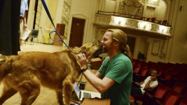 Puppy love ... Leo gives Pittsburgh Symphony horn player Bob Lauver a fond greeting.