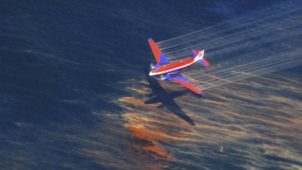 The crew of a Basler BT-67 fixed wing aircraft release oil dispersant over an oil discharge from the mobile offshore drilling unit, Deepwater Horizon, off the shore of Louisiana, in this May 5, 2010 photo.