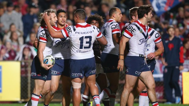 Hat-trick hero: Brendan Elliot of the Roosters celebrates a try.