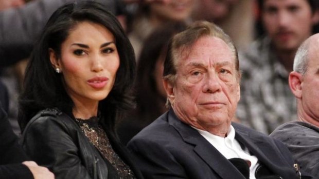Life ban for racist comments ... Los Angeles Clippers owner Donald Sterling, right, sits with girlfriend V. Stiviano as the Clippers play the Los Angeles Lakers.