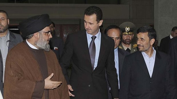 Line of supply ... Hezbollah leader Hassan Nasrallah, left, chats with the Syrian President, Bashar al-Assad, and the Iranian President, Mahmoud Ahmadinejad, before an official dinner in Damascus in 2010.