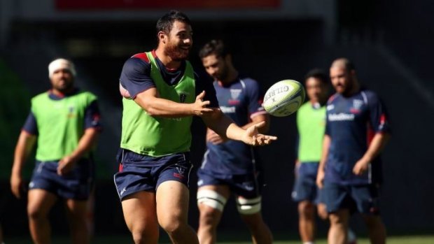 Cruze Ah-Nau of the Rebels releases the ball during a training session at AAMI Park on Wednesday.