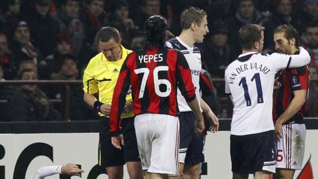 Mathieu Flamini of Milan argues with Rafael van der Vaart of Tottenham after his crude tackle on Vedran Corluka.