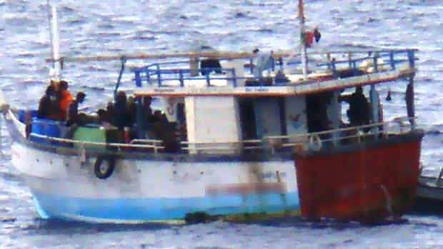 Photographs released by the Federal Government showing the interception of the latest boat of asylum seekers off Western Australia yesterday.