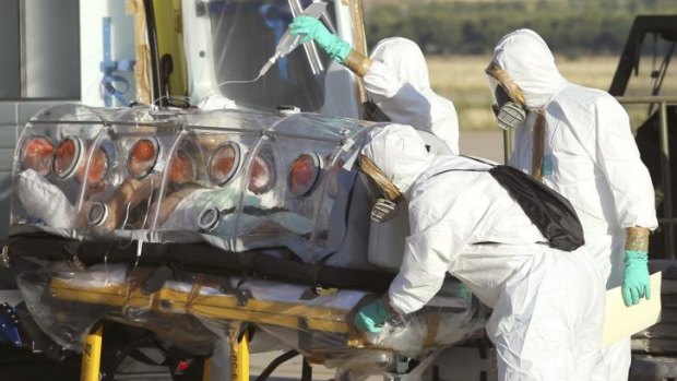 Aid workers and doctors in Spain transfer Miguel Pajares, a Spanish priest who was infected with the Ebola virus while working in Liberia.