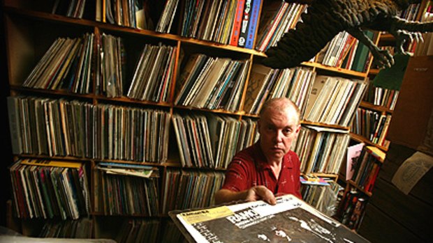 The Tote’s Bruce Milne sorts through his 6000 or so records, a collection he’s selling to pay off some of his debts.