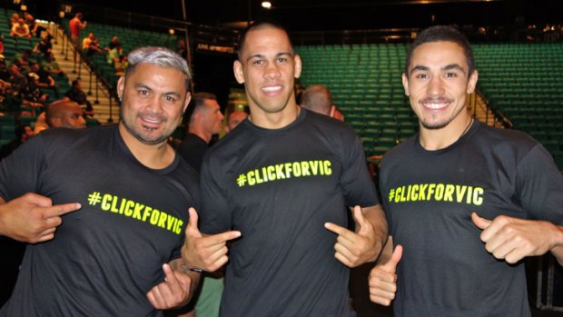 Australian UFC fighters (from left) Mark Hunt, Jamie Te Huna and Robert Whittaker get behind the #ClickForVic campaign after the UFC 160 weigh-in at the MGM Grand Garden Arena in Las Vegas.