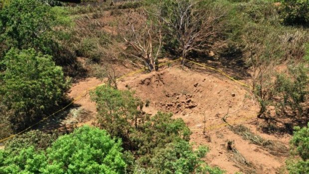 A photo provided by the Nicaraguan Army shows an impact crater made by a small meteorite in a wooded area near Managua's international airport.