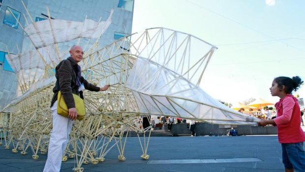 Theo Jansen's giant Strandbeests are on the march in Federation Square, with the help of engineer Lionel Roy.