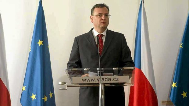 Czech Prime Minister Petr Necas answers journalists at a press conference in Prague on Thursday.