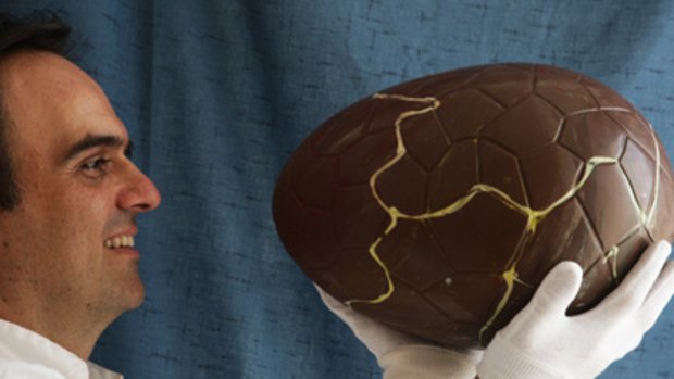 Nest egg... chocolatier John Kapos with a giant Easter treat at his Banksmeadow factory.