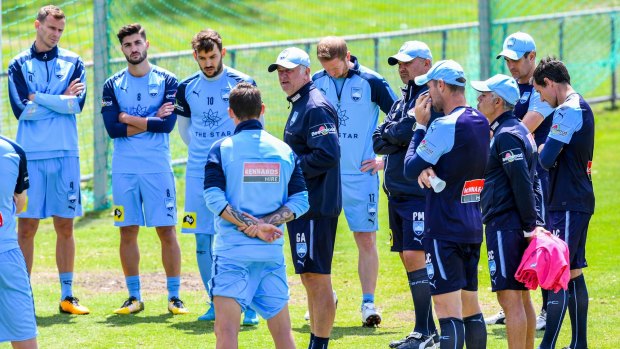 Talking point: Graham Arnold addresses the troops at Sydney FC training.