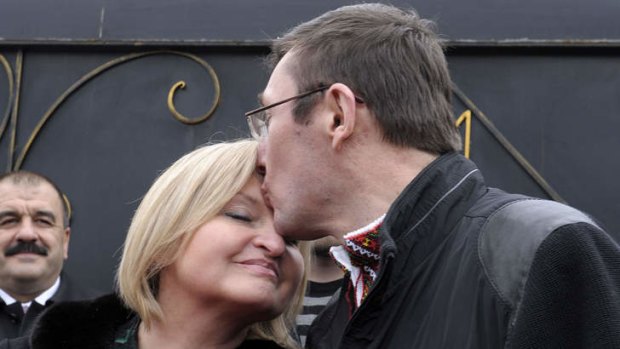 Release ... Yuri Lutsenko kisses his wife Iryna after emerging from the prison.
