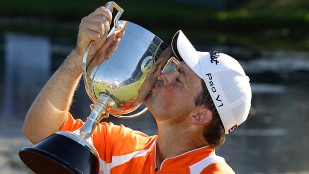 On a high ... Greg Chalmers kisses the Kirkwood Cup after winning the Australian PGA Championship.