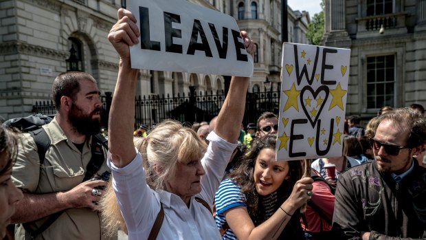 A 'Leave' campaigner and a supporter of 'Remain' during demonstrations over the Brexit vote in London